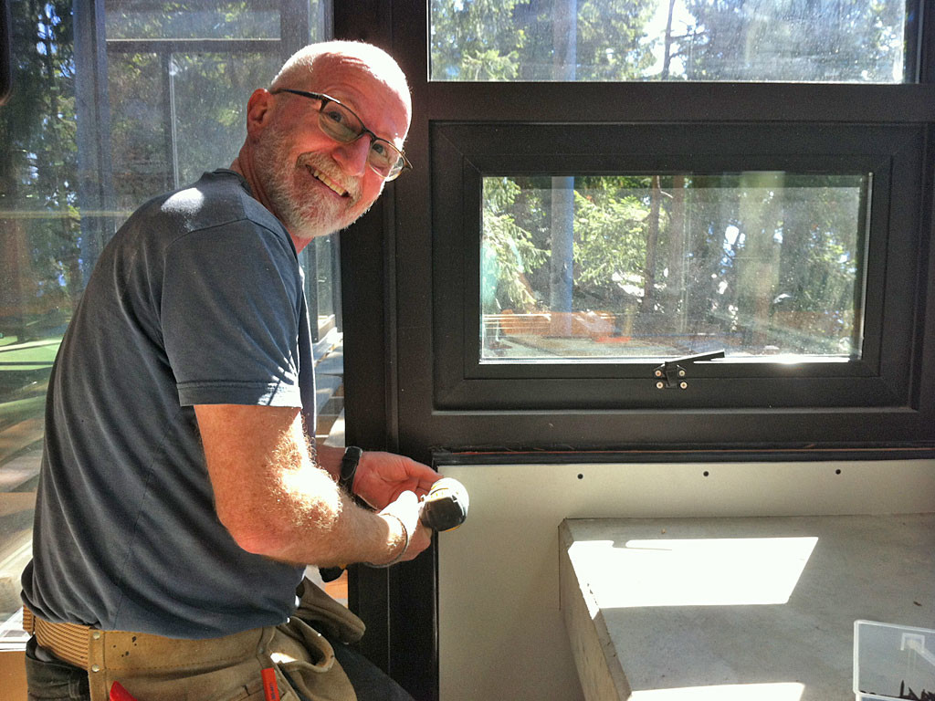 last piece of drywall is hung in Far & Wide Marketing's Galiano Island sattelite office